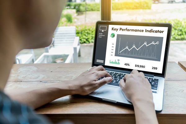 man-and-laptop-flooring-software-increasing-sales